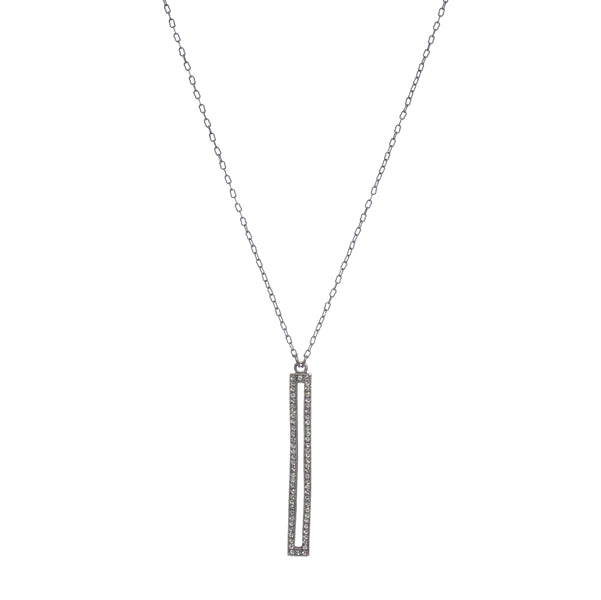 skinny rectangle crystal pave pendant necklace. Made with an antique brass finish with black diamond crystal accents on a 16" chain with a lobster clasp closure. Handmade in New York.