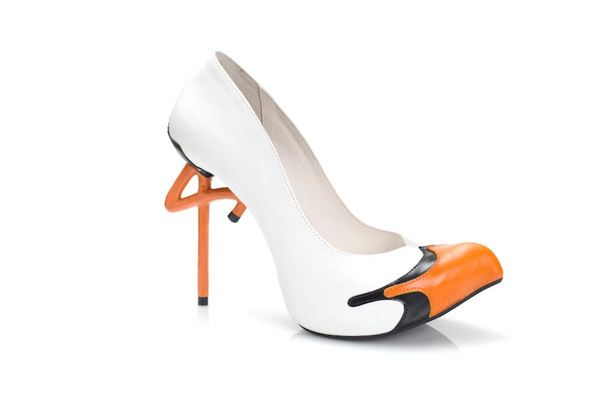 Hand crafted stork bird inspired high heel shoe in white and orange with unique stiletto heel design.