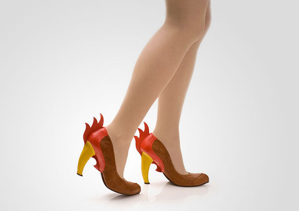 Chicken inspired high heel shoe in cream, red, and yellow. Handcrafted limited edition shoe pair on model.