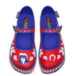 A pair of red and blue checkered Mary Jane platform shoes with a printed fabric upper and a customizable buckle strap, featuring a non-marking rubber sole top