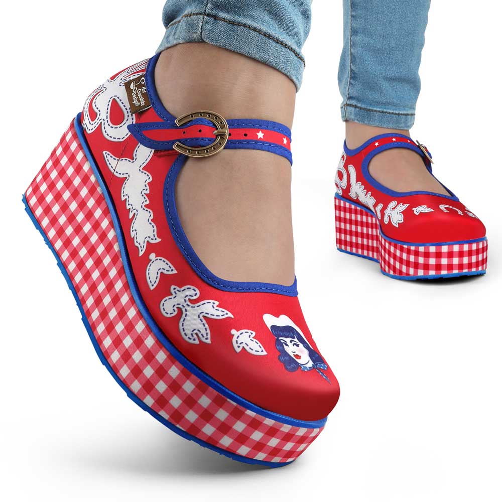 A pair of red and blue checkered Mary Jane platform shoes with a printed fabric upper and a customizable buckle strap, featuring a non-marking rubber sole model