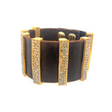 wide band bracelet features double sided black diamond crystal accented 18K gold plated bars on a vintage brown leather brand. Handmade in New York.