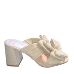 Rustic beige heel with a bow close-up