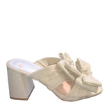 Rustic beige heel with a bow close-up