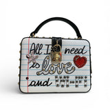 Handbag with decorative text and heart design