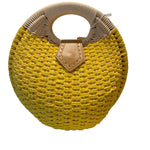 Yellow woven handbag with beige handle and flap