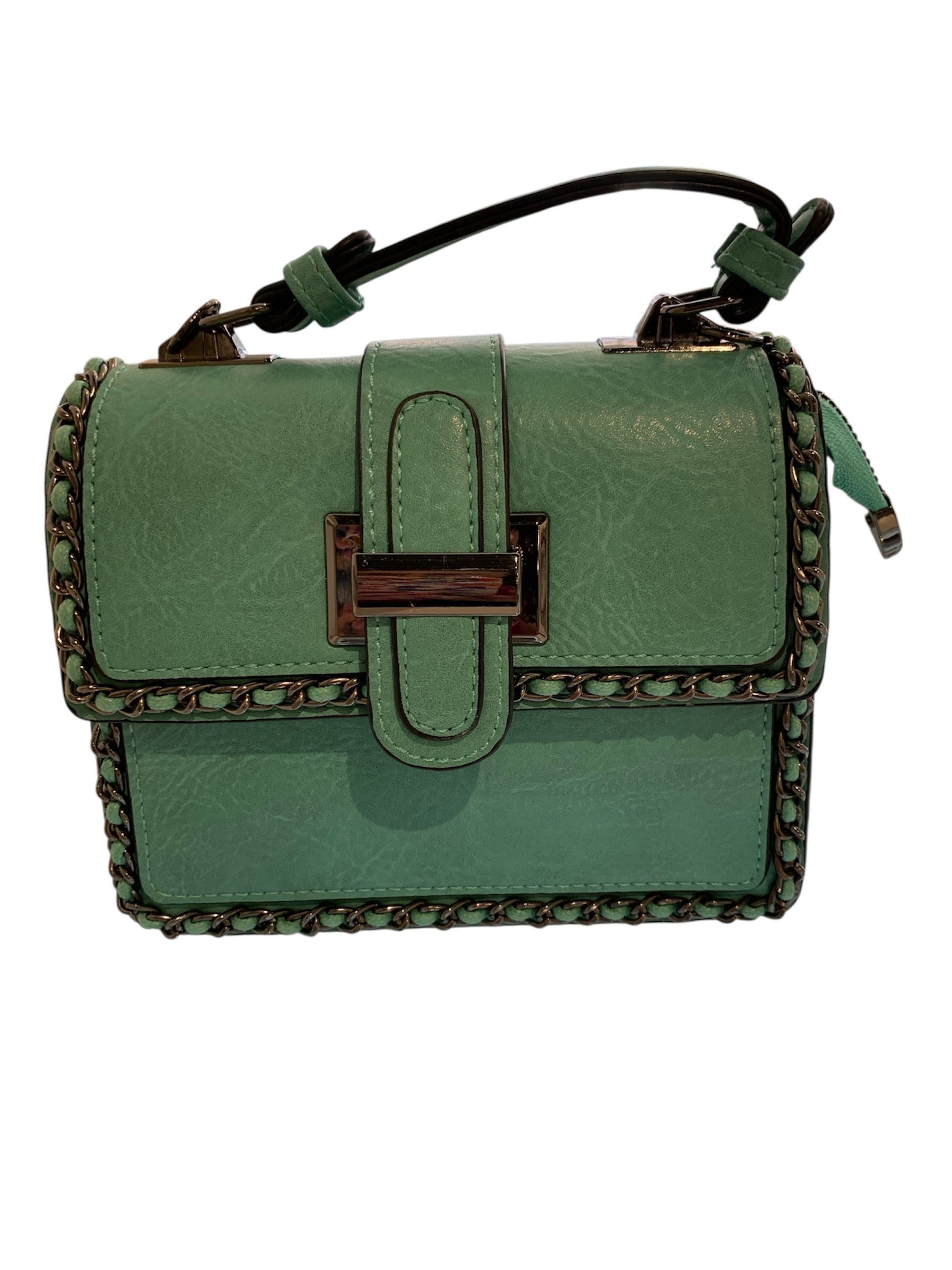 Green handbag with braided details closeup