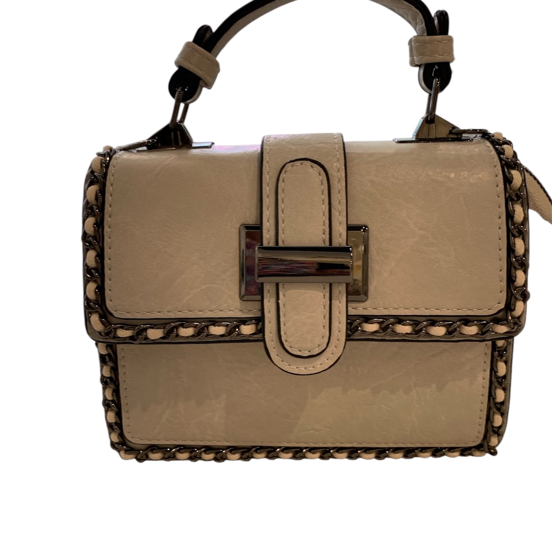 Beige handbag with studded details closeup