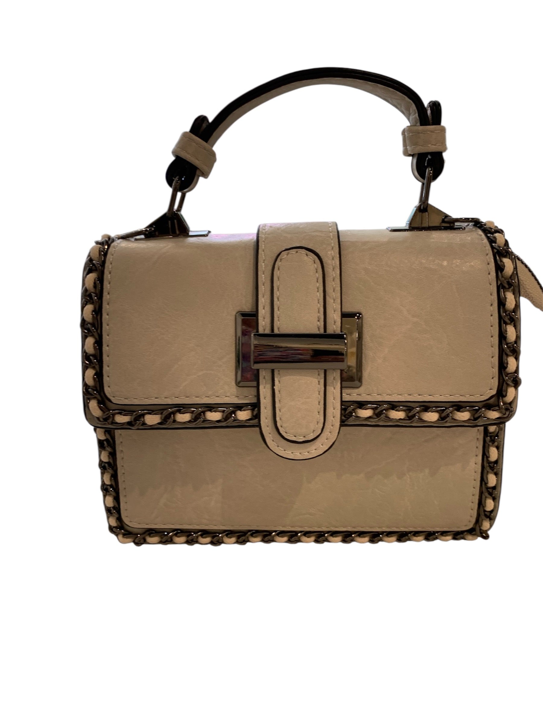 Beige handbag with studded details closeup