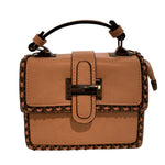 Tan handbag with decorative stitching closeup