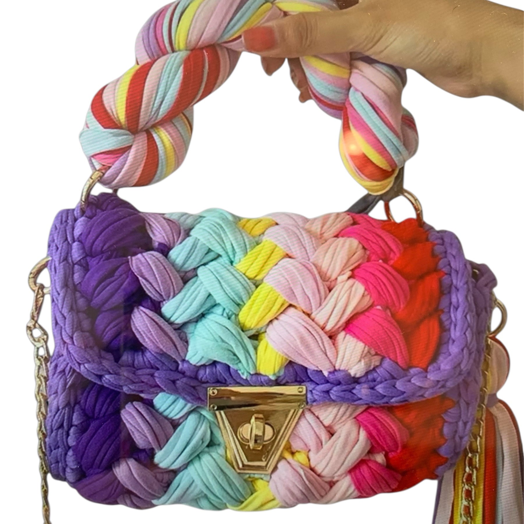 Colorful woven handbag with a braided handle closeup