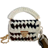 Woven handbag with a checkered pattern closeup
