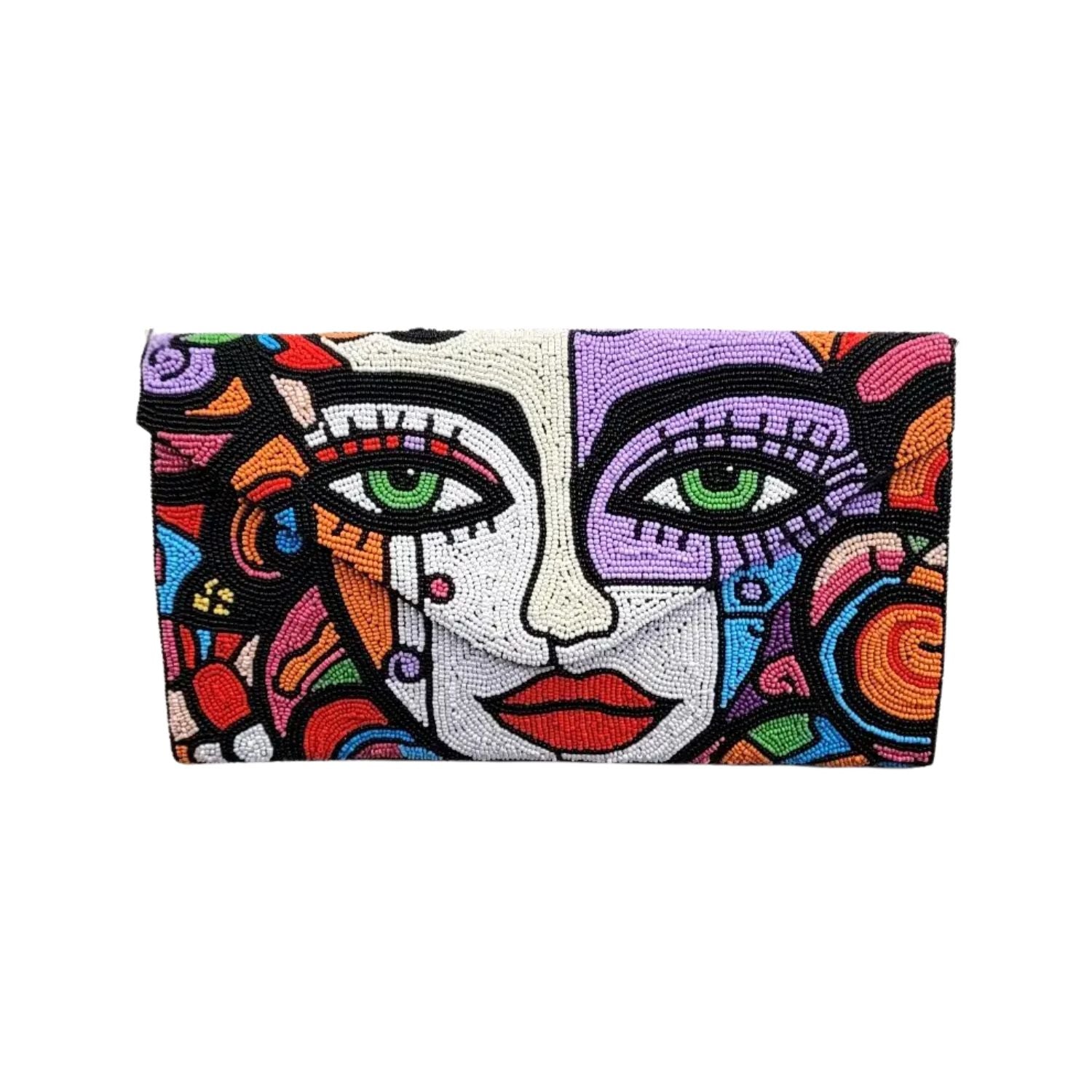 Colorful clutch bag with abstract face design on a white background