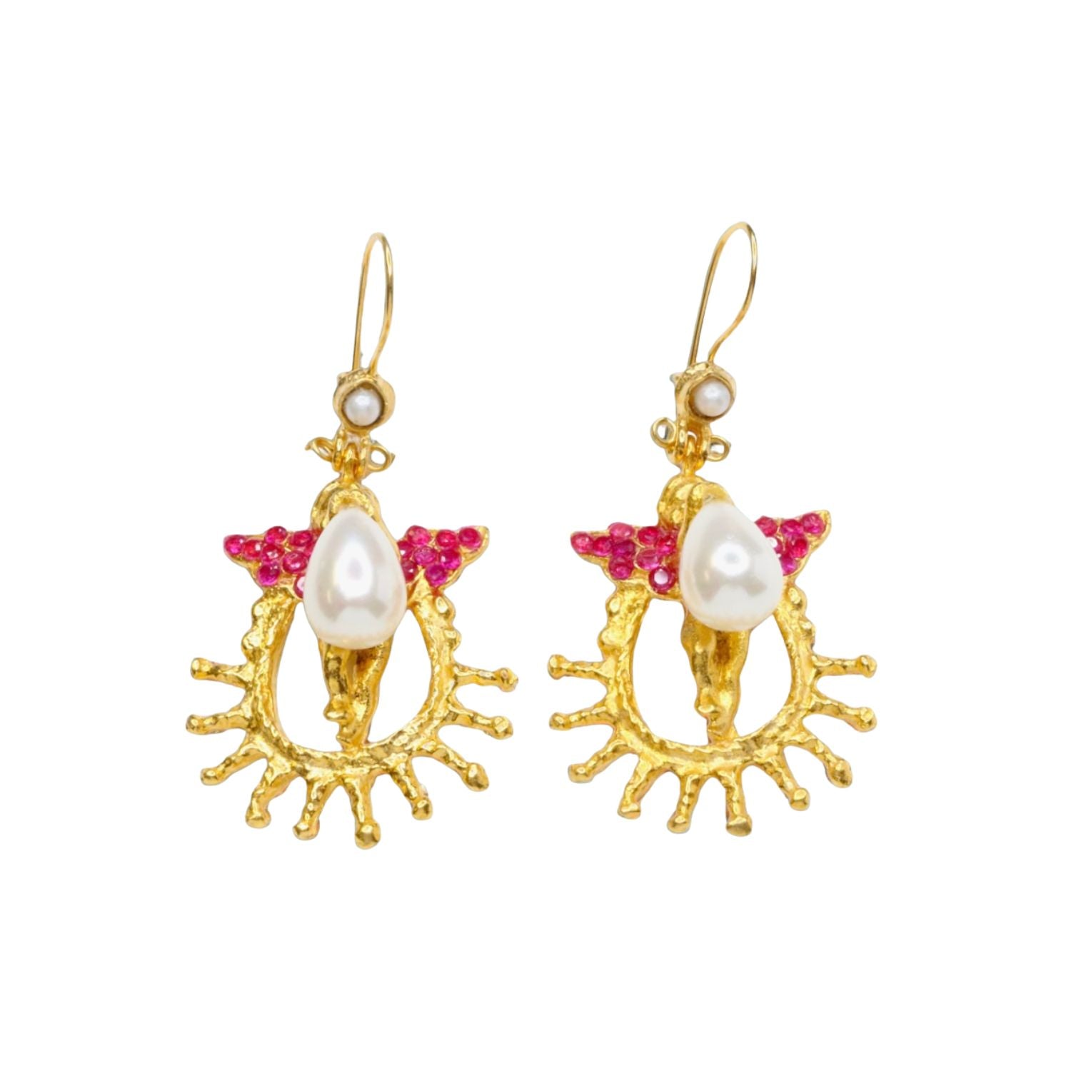 Gold colored earrings with pearl like beading and pink crystal accents on a white background