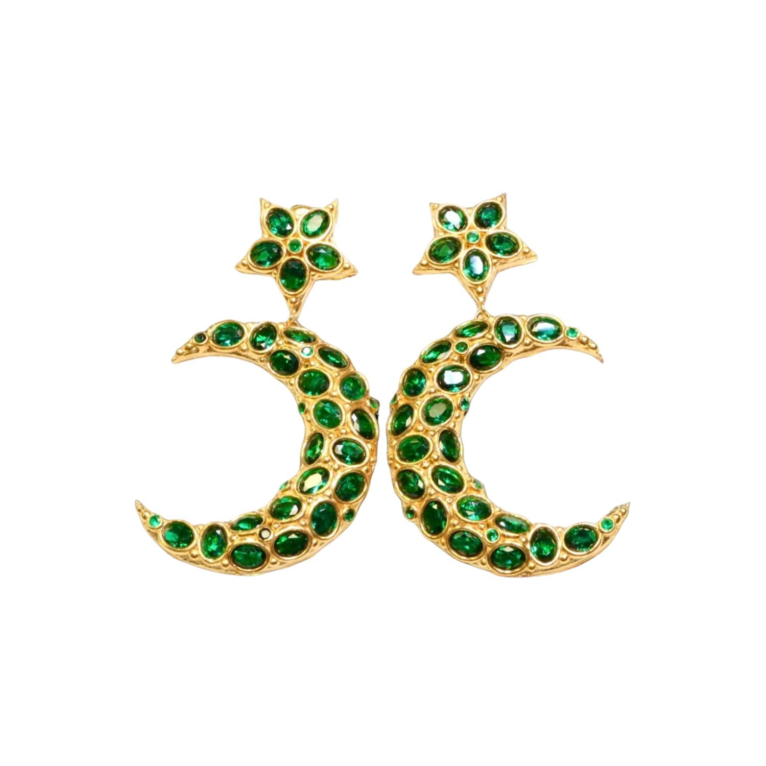 Gold colored moon and star shaped earrings with green crystal accents on a white background