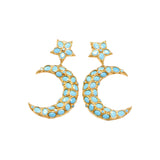 Gold and turquoise colored moon and star shaped earrings on a white background