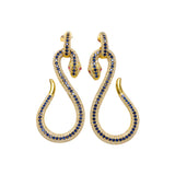 Gold snake-shaped earrings with blue and red crystals on a white background