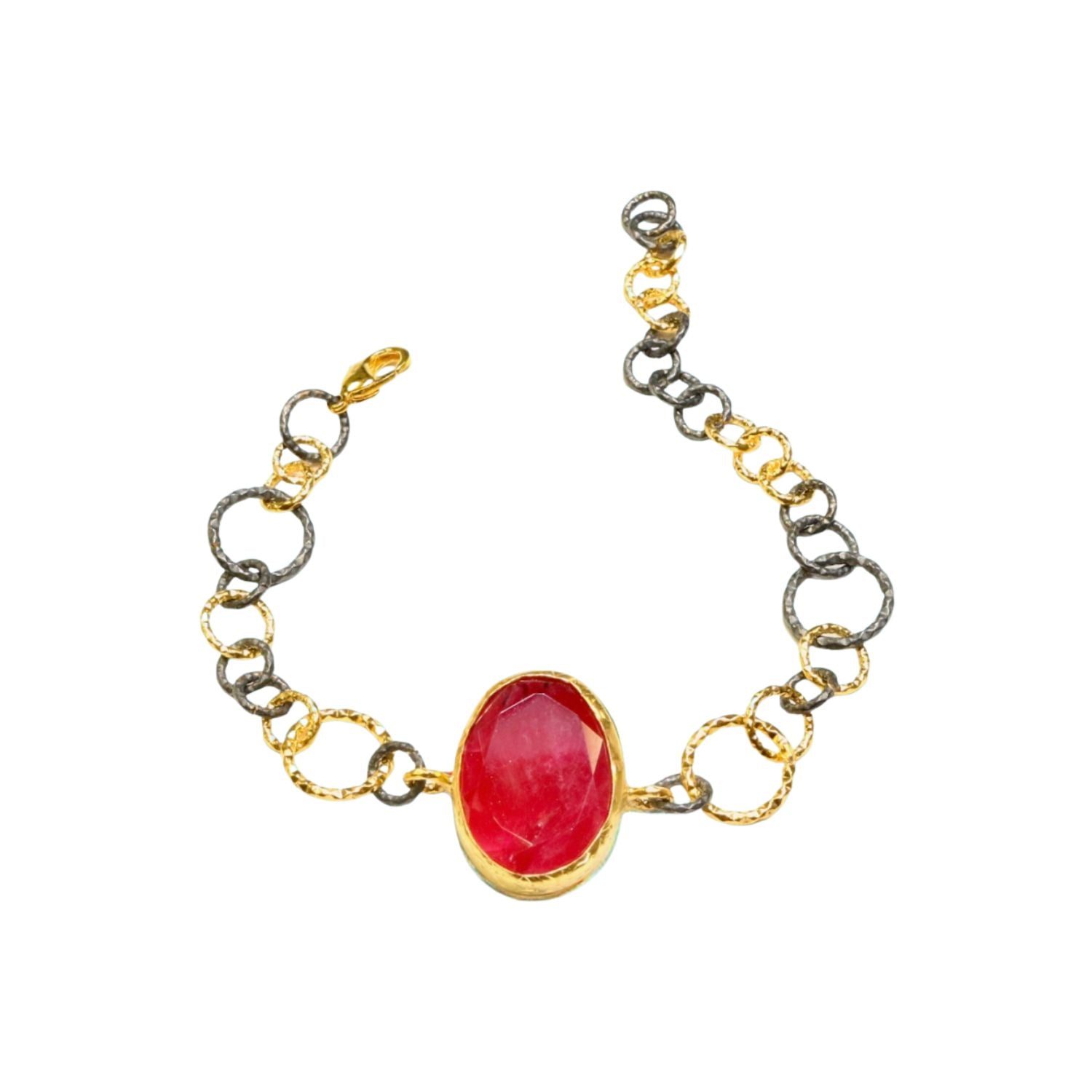 Bracelet with a red stone center on a gold and silver large loop chain on a white background