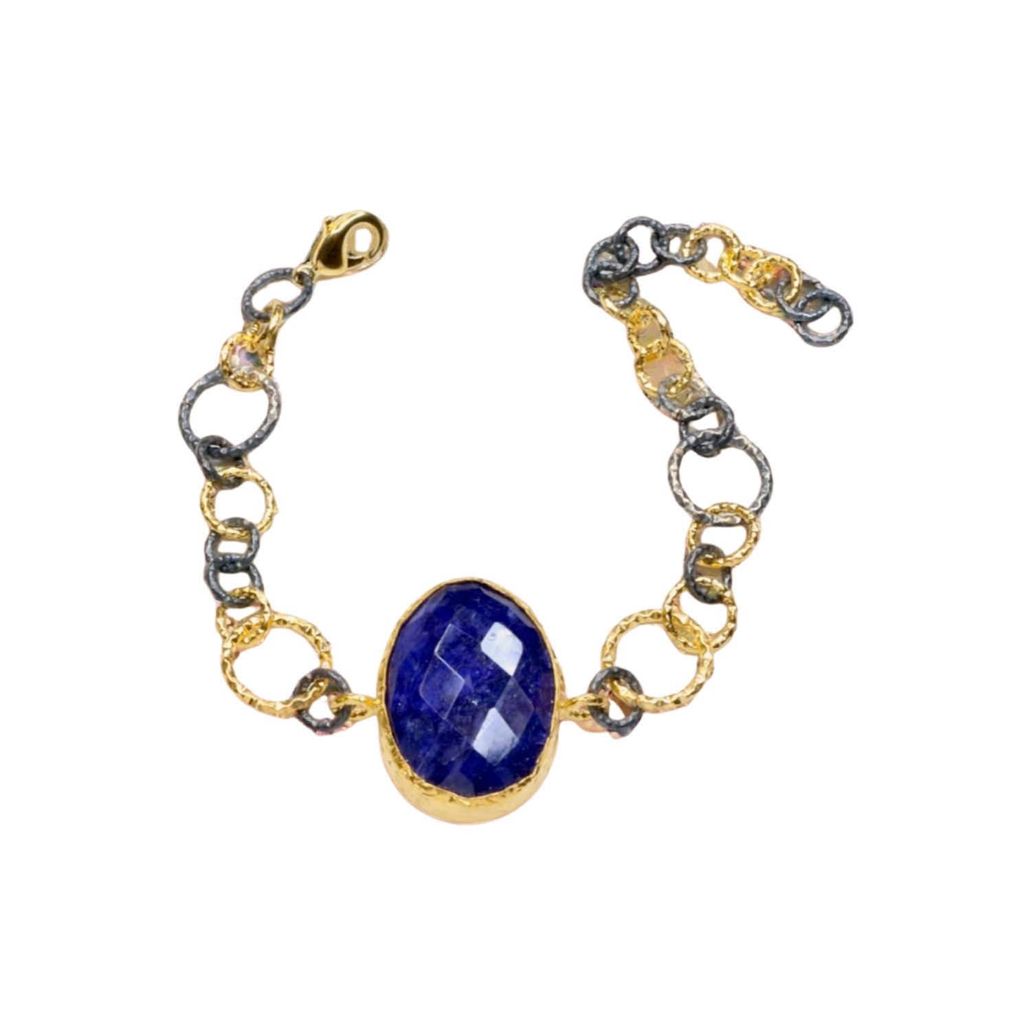 Gold and silver colored large loop chain  bracelet with blue stone on a white background