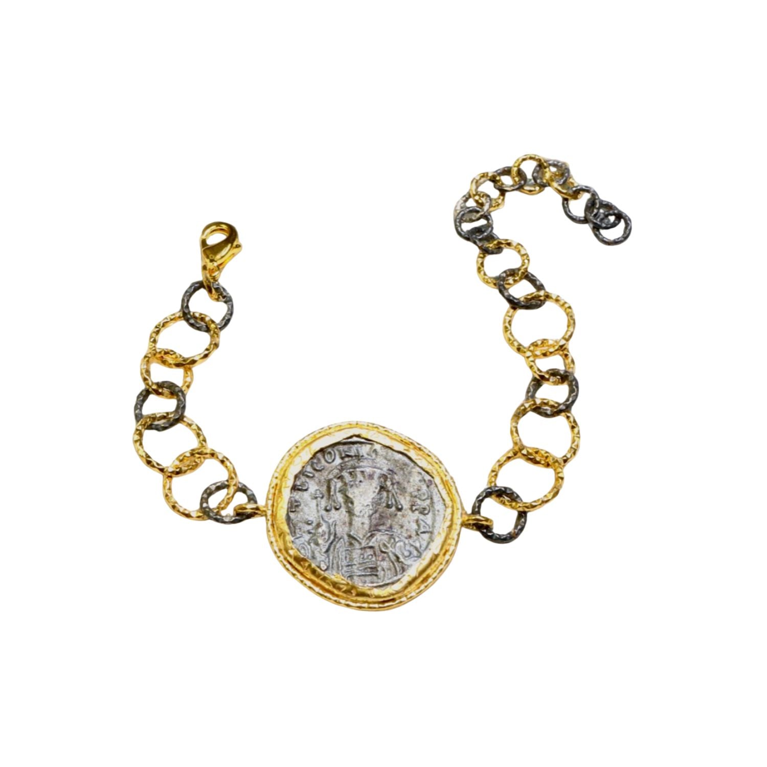 Bracelet with gold and silver large loop chain and coin charm on a white background