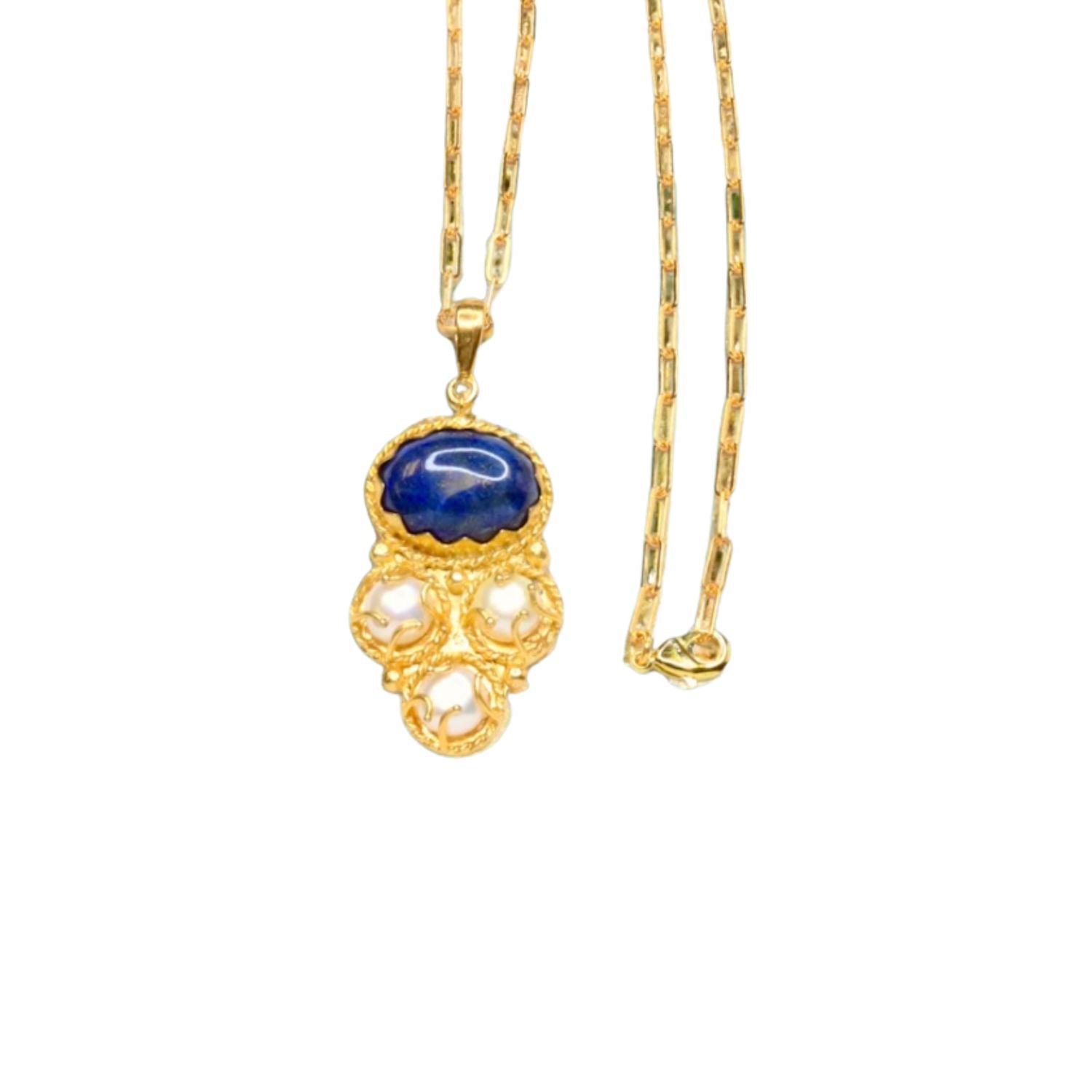 Gold colored necklace with a blue pendant and pearl-like elements with elongated link chain