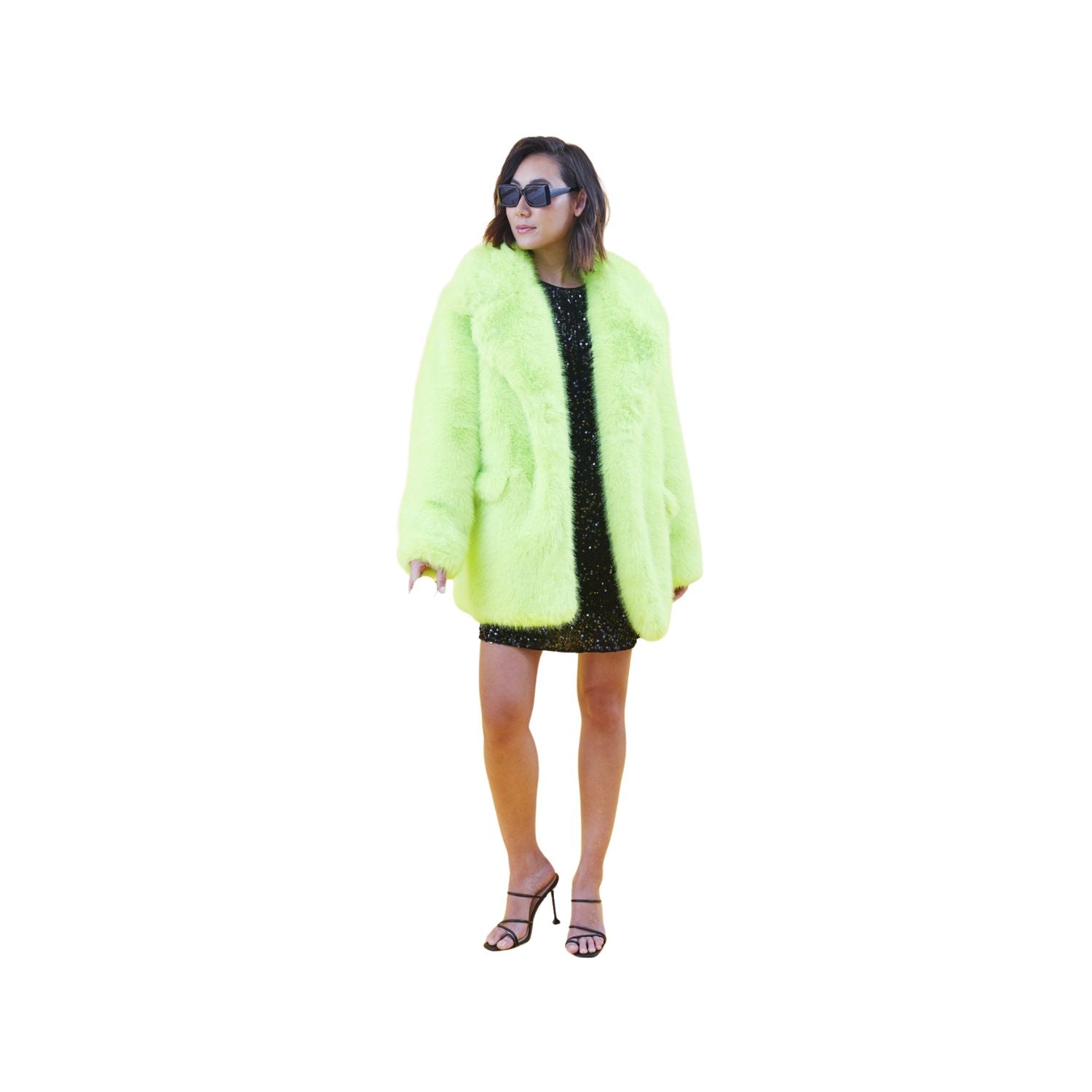 Person wearing a bright green fur like coat on a white background