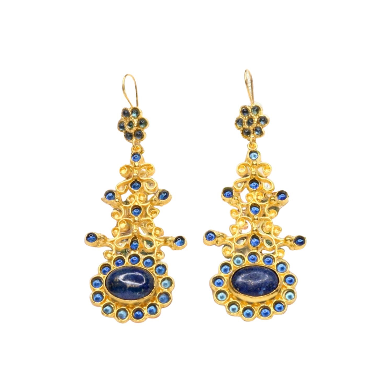 Gold colored earrings with blue stone accents on a white background