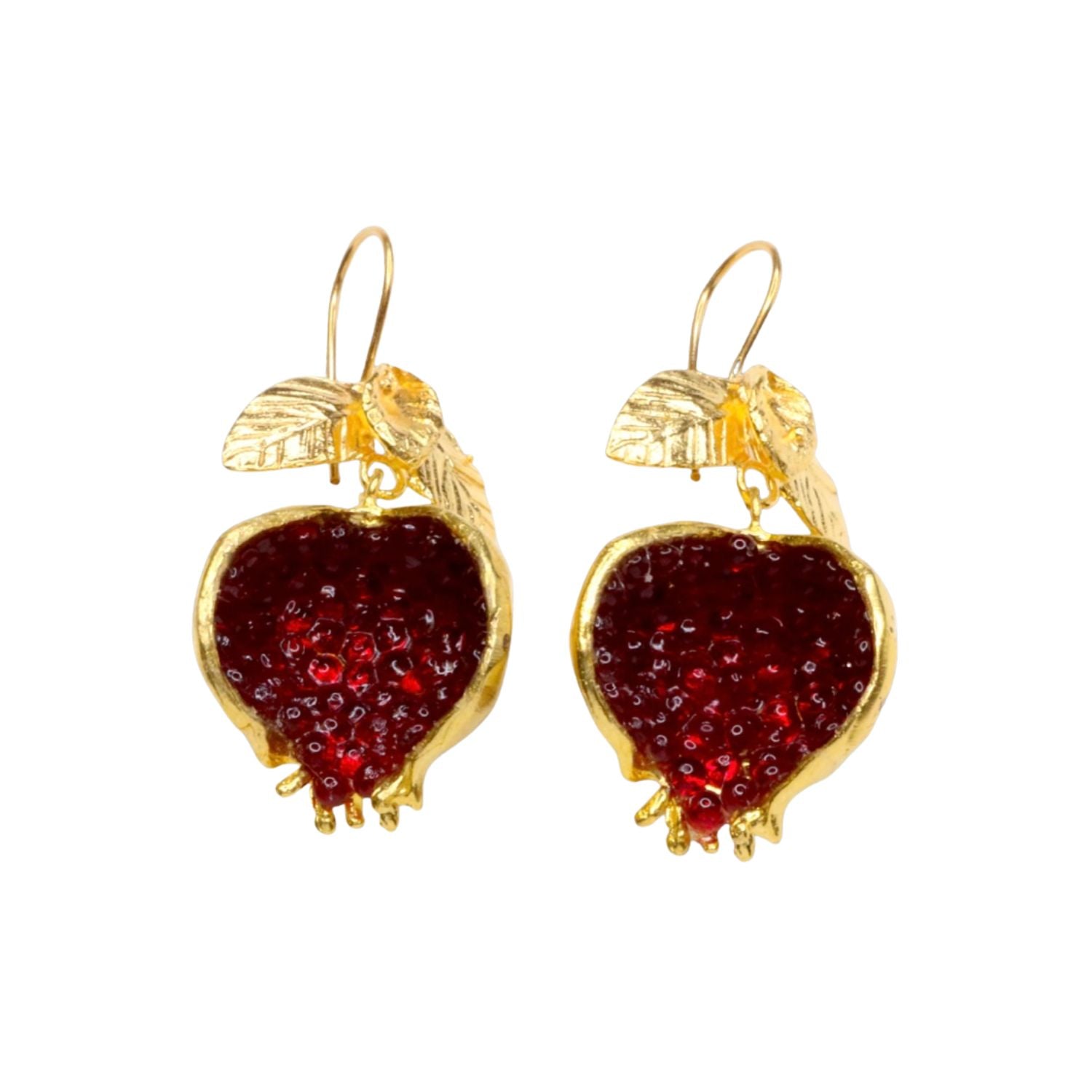 Gold colored pomegranate shaped earrings with red stone accents on a white background