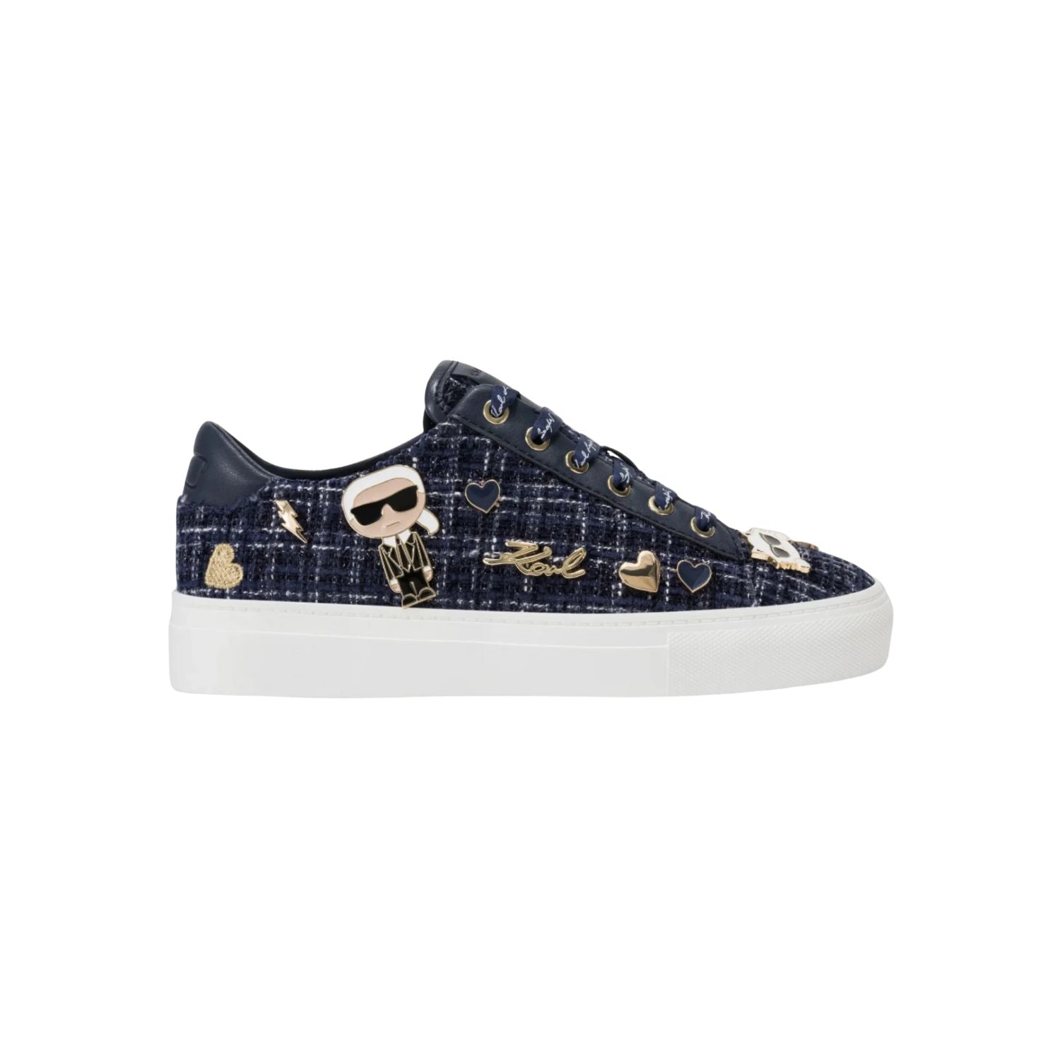 Black sneaker with gold embellishments on a white background