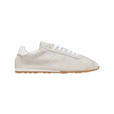 Italian-made sneaker featuring a trendy silhouette in ultra-soft suede. The SERINA sneaker in ivory features a rubber sole and white shoe laces.
