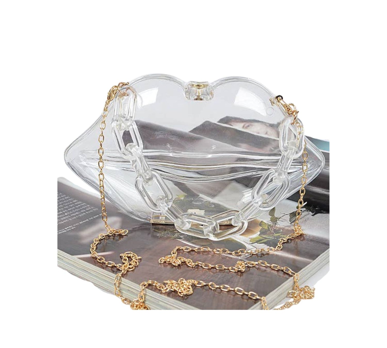 clear lip shaped purse with gold colored chair strap