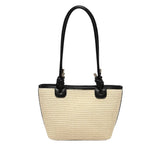 Beige straw handbag with black accents and black shoulder strap 
