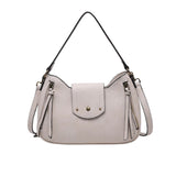 Light gray handbag with tassels and a strap 