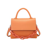 Orange handbag with a chain detail, hand strap and shoulder strap