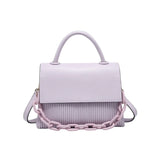Lavender handbag with a chain detail, hand strap and shoulder strap