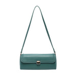 Green handbag with a strap and brass clasp
