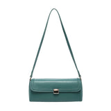 Green handbag with a strap and brass clasp