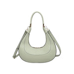 Light green handbag with a hand strap and shoulder strap