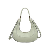 Light green handbag with a hand strap and shoulder strap