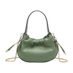 Green handbag with chain detail and hand strap