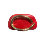Red clutch with gold metal band