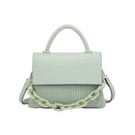 Light green handbag with a chain detail, hand strap and shoulder strap