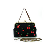 Black handbag with red cherry design 