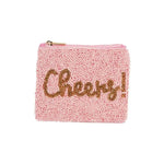 Pink beaded pouch with 'Cheers!' text 
