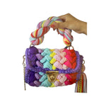Colorful woven handbag with a braided handle 