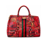 Red graffiti-patterned handbag with green and black accents 