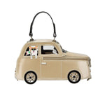 Beige car-shaped handbag with a dog charm