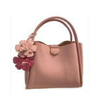 Pink handbag with floral details 