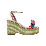 Colorful raffi green striped wedge sandal with with fruit strap and strawberry embellishment on a white background