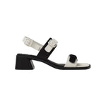 Black and white modern sandal with a block heel and buckle straps on a white background